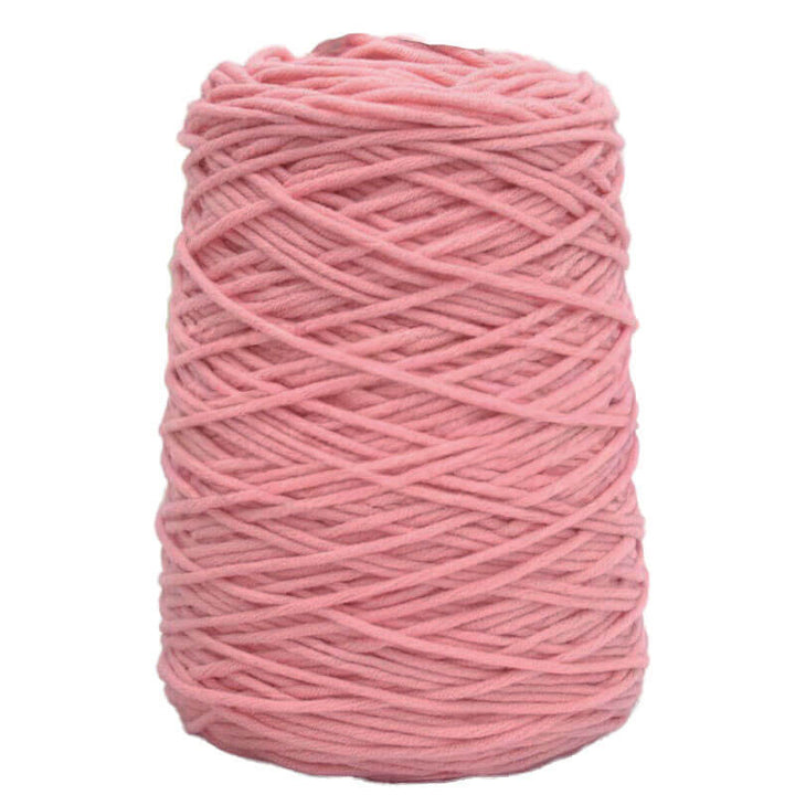 Pink acrylic tufting yarn ball on a white background