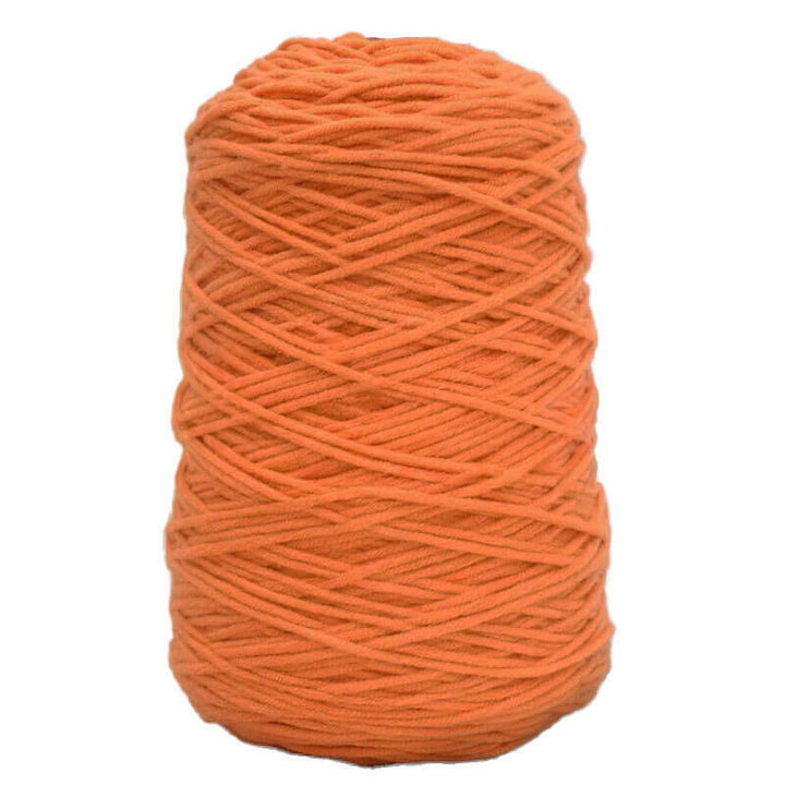 Orange cone of acrylic tufting yarn