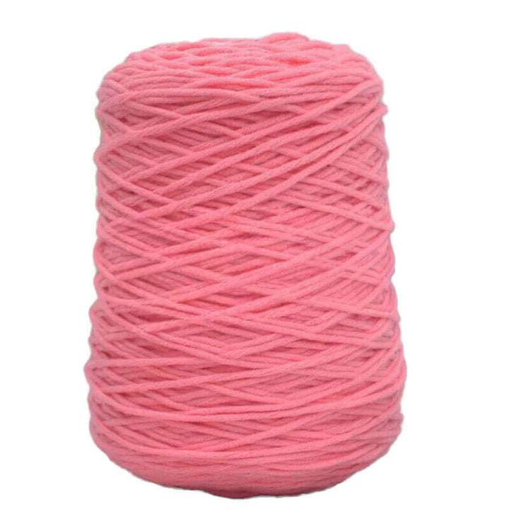 Pink acrylic tufting yarn on a white background