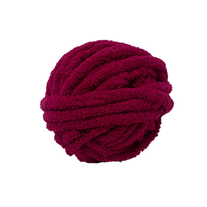 Maroon chunky chenille yarn ball on a white background