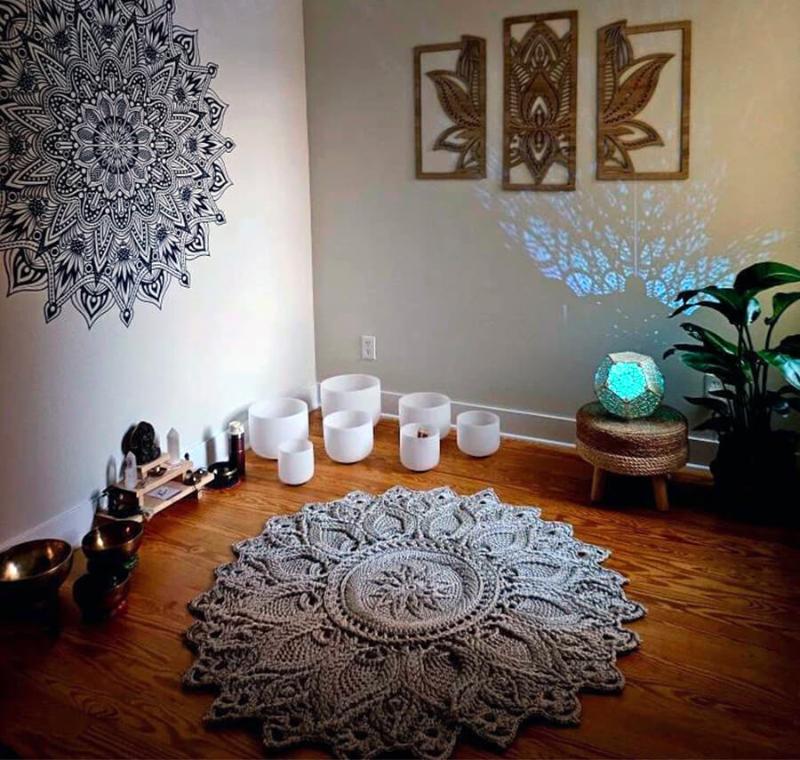 Picture of the crocheted round rug in a room on the floor