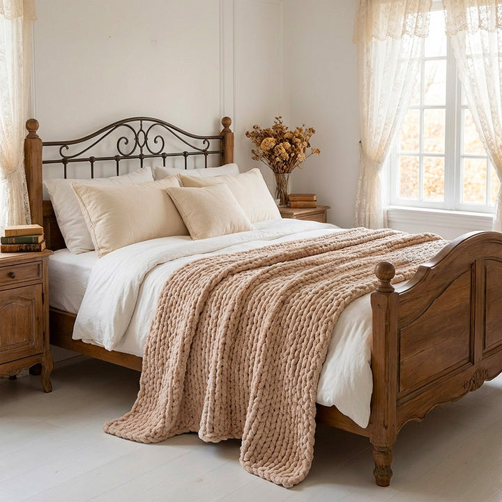 sand colour chenille knit blanket on the wooden bed in a light and cozy bedroom