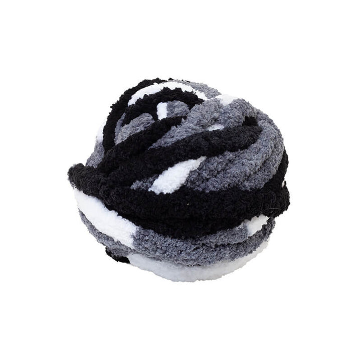 Plush ball yarn with black, gray, and white colors on a white background