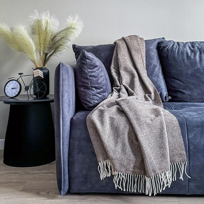 brown merino wool blanket on a sofa in living room