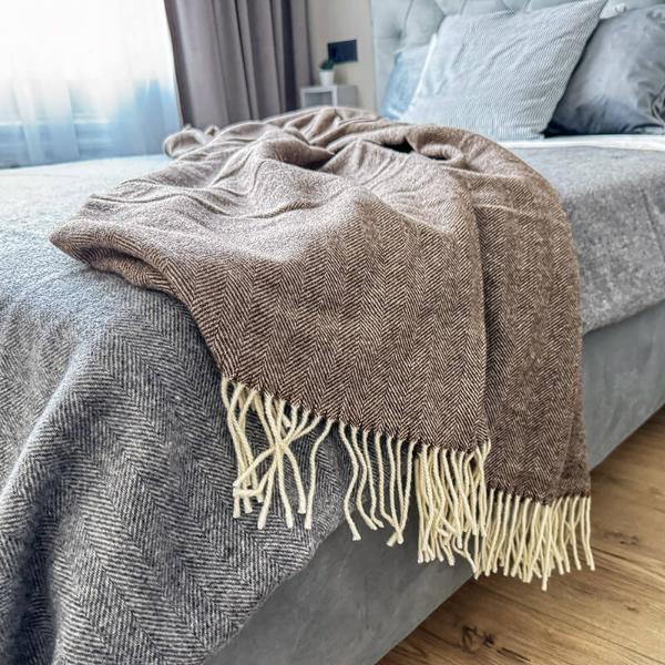 brown woven merino wool blanket on bed