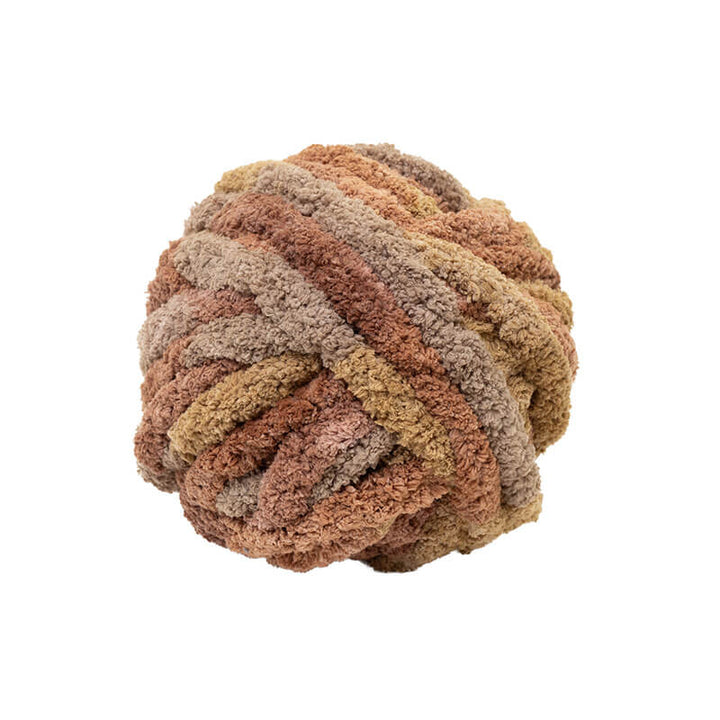 Coiled piece of multicolored yarn on a white background