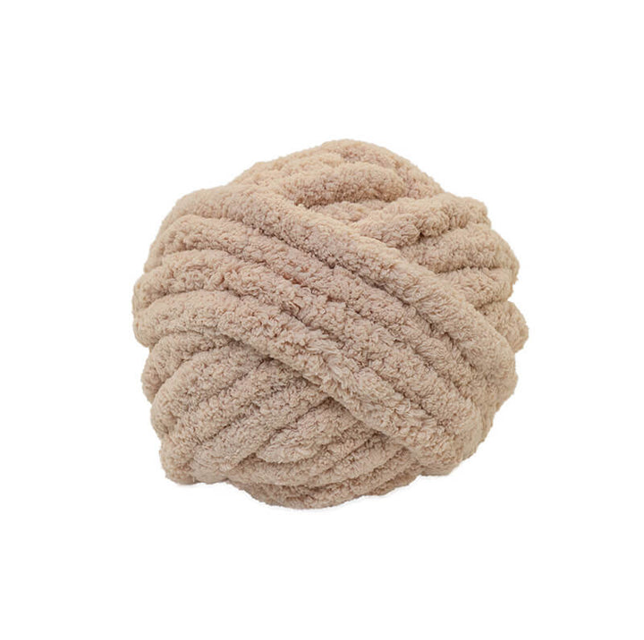 Beige jumbo chenille yarn on a white background