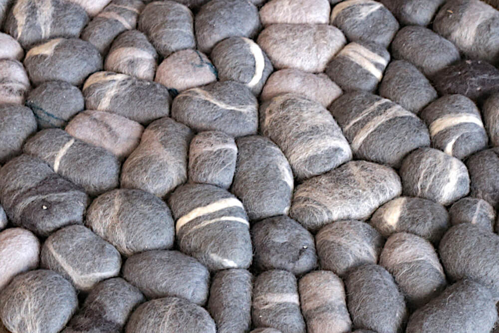 a close picture and details of the felted wool pebbles rug