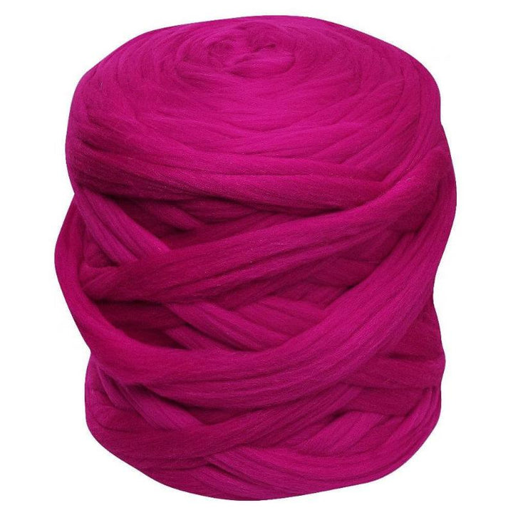 fuchsia color jumbo yarn ball in white background