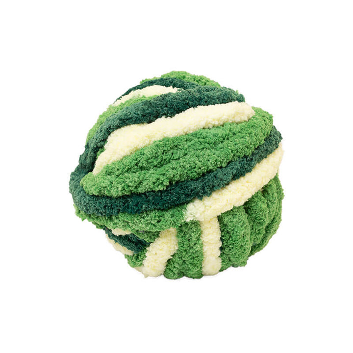 Green and yellow chunky chenille yarn ball on a white background