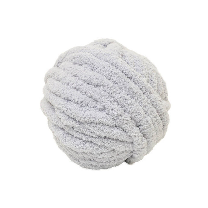 Large ball of gray yarn on a white background