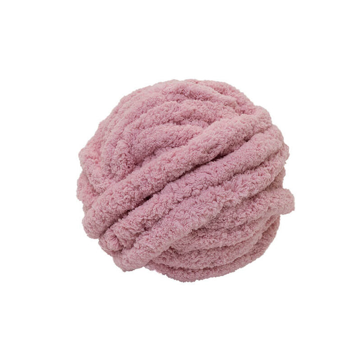 Pink textured chenille yarn ball of yarn on a white background