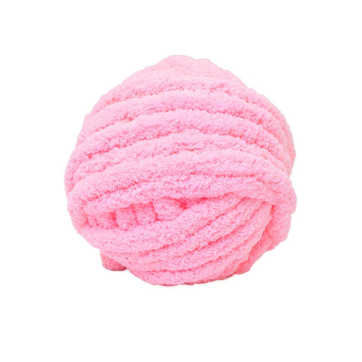 Pink giant yarn ball on a white background